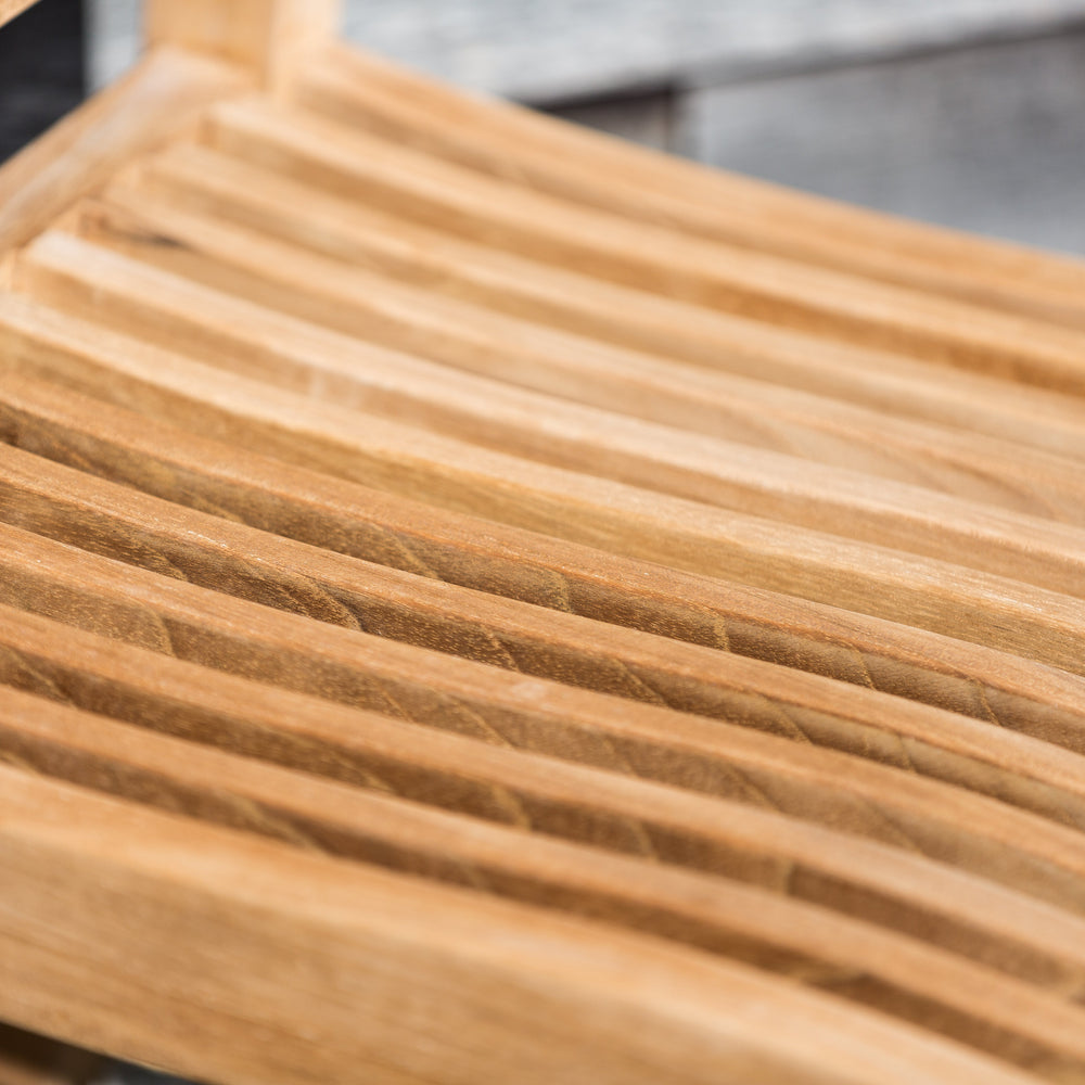 
                  
                    Close up shot of seat of single teak outdoor dining chair 
                  
                