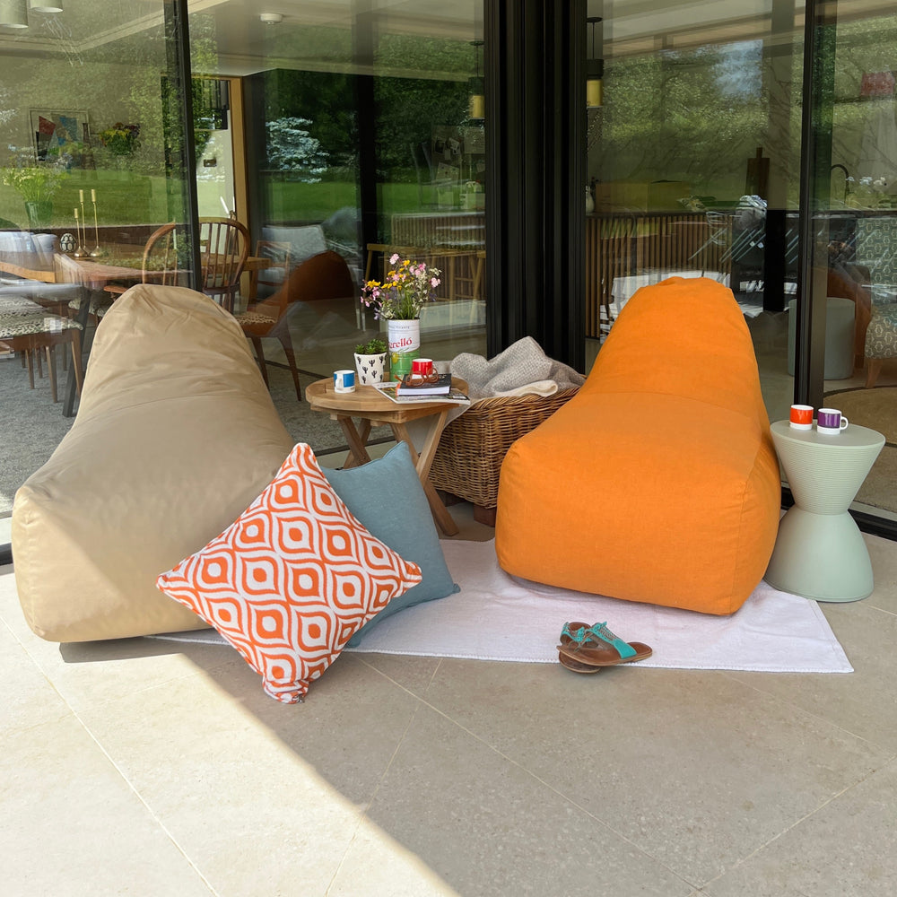 
                  
                    Teakunique's stone and orange beanbag style outdoor chairs
                  
                