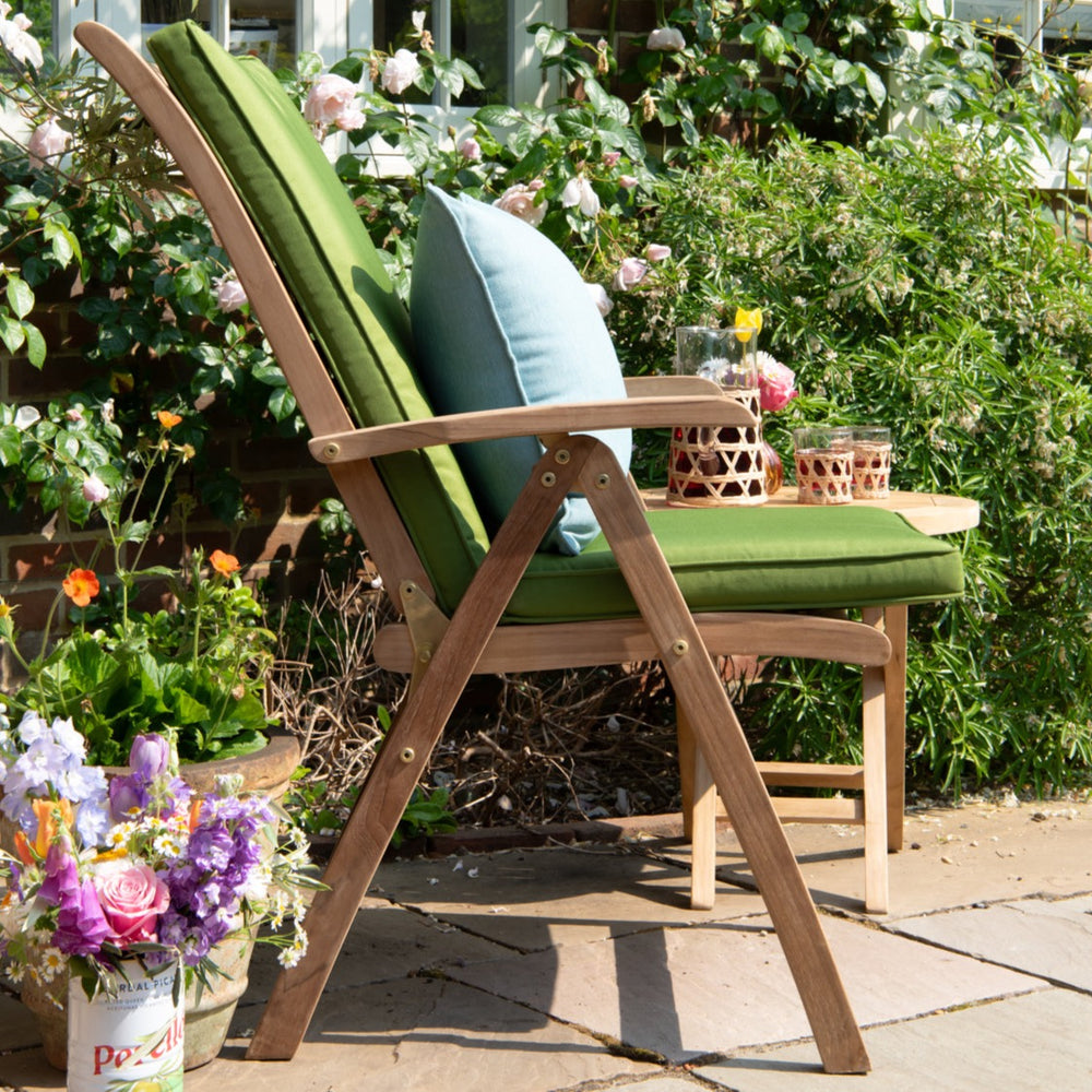 
                  
                    Teakunique's redesigned Borneo recliner with green cushion side profile
                  
                