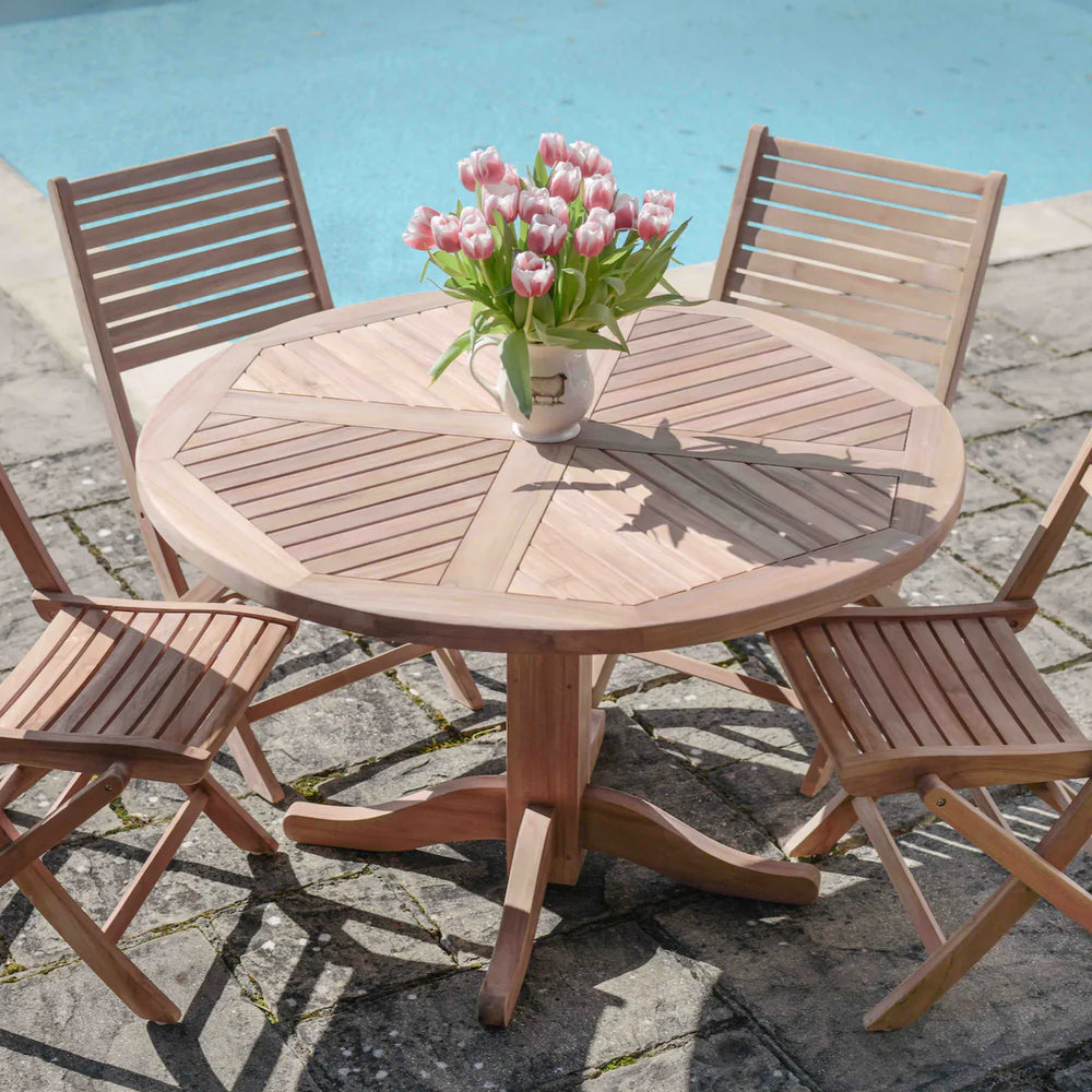 
                  
                    Teakunique's Daisy pedestal table with Sumatra folding chairs by pool
                  
                