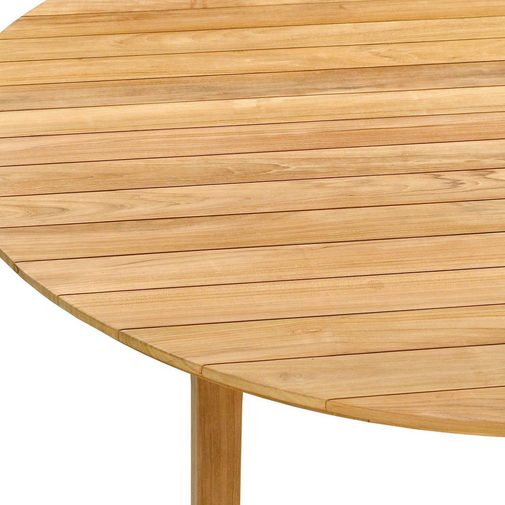 
                  
                    Close up of edge of round teak outdoor table 
                  
                