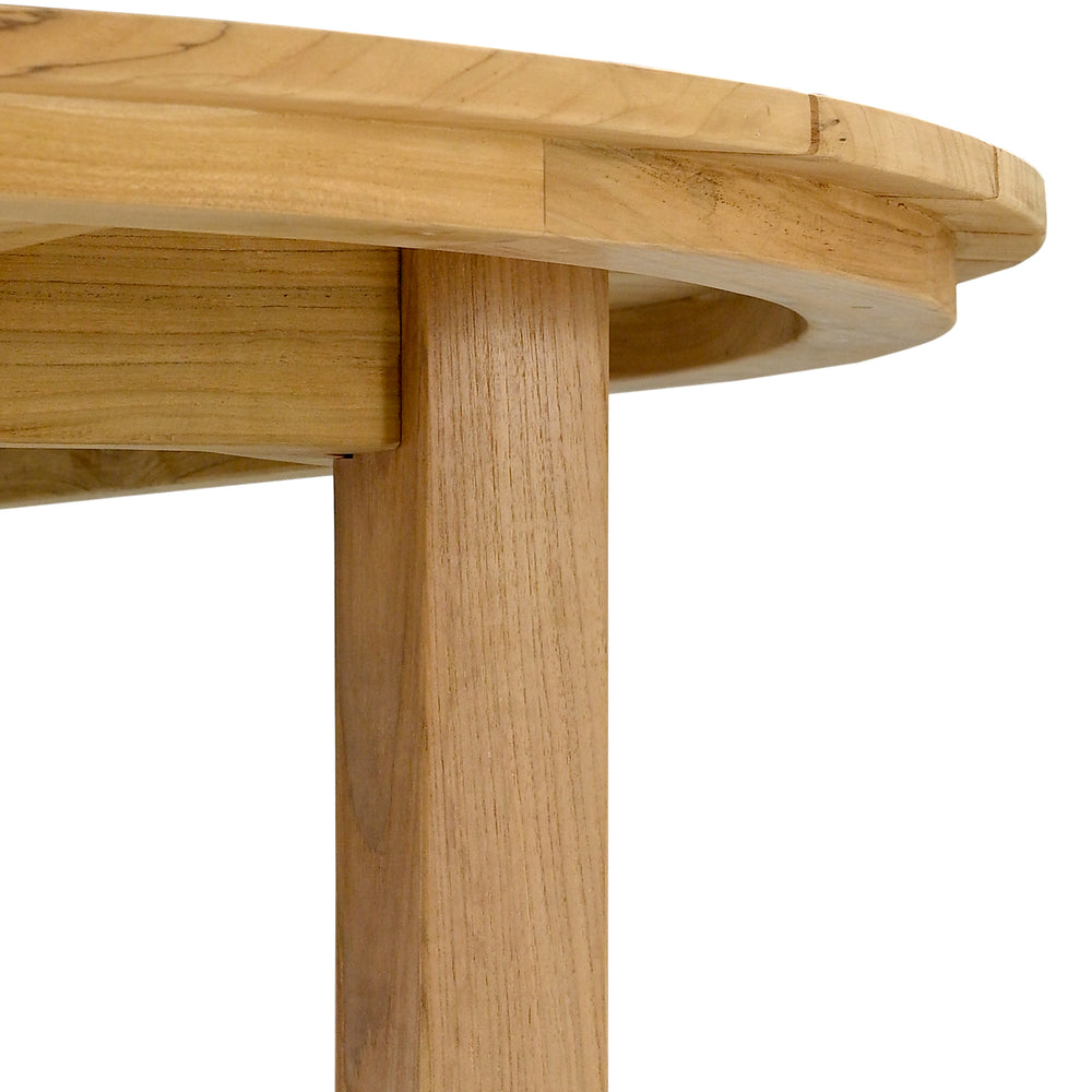 
                  
                    Close up of edge of round teak table and table leg
                  
                