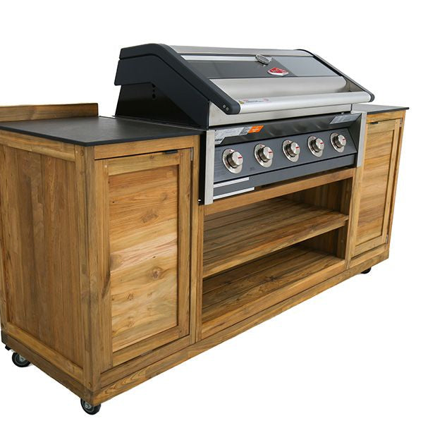 Teak outdoor kitchen unit with built-in barbecue, cabinets either side and shelves beneath, on a white background