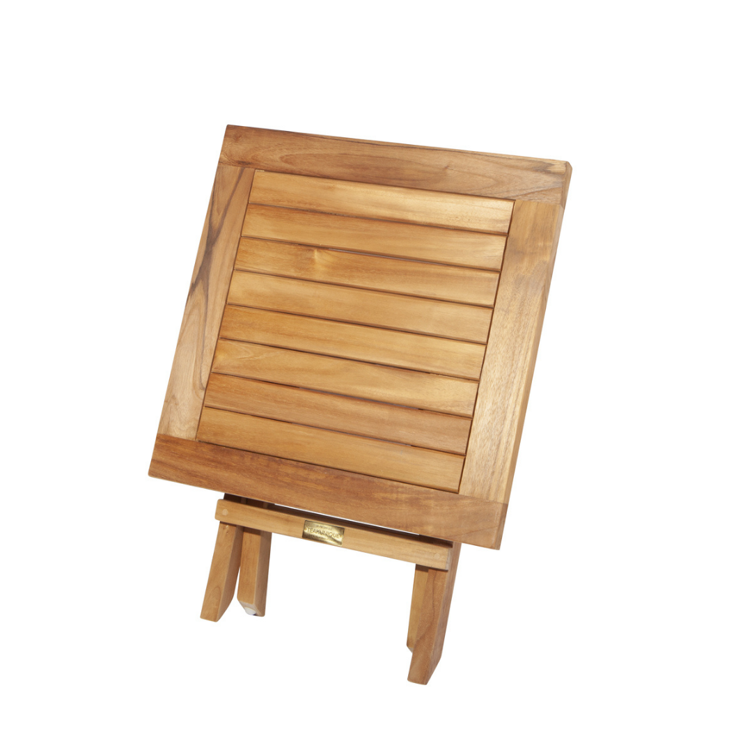 Teak folding square coffee table, in folded, upright position with legs visible beneath tabletop, on a white background. 