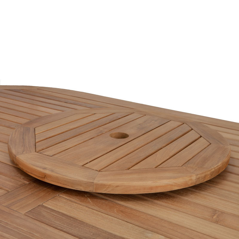 
                  
                    Teak lazy susan turntable on top of teak dining table, on white background
                  
                