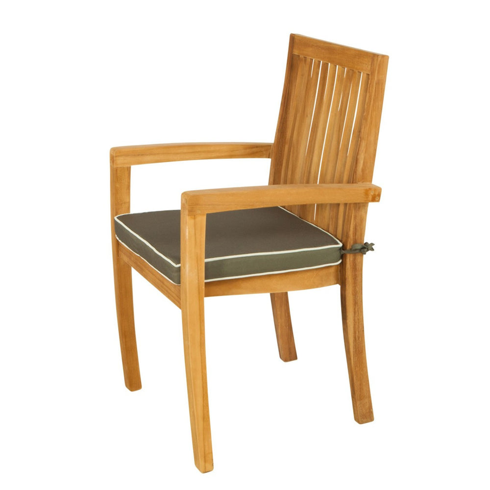 
                  
                    Side view of teak dining chair with arms and grey and white cushion, on a white background. 
                  
                