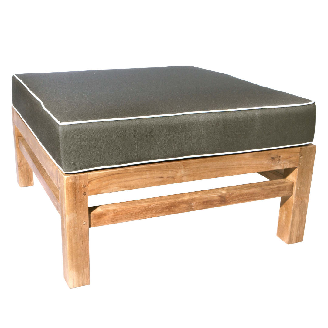 Teak ottoman stool with green cushion with white trim. The stool is on a white background.  
