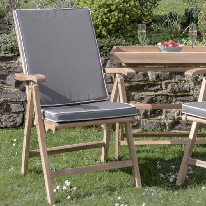 Teakunique's Borneo recliners with grey cushions on the lawn with a Butler's Tray